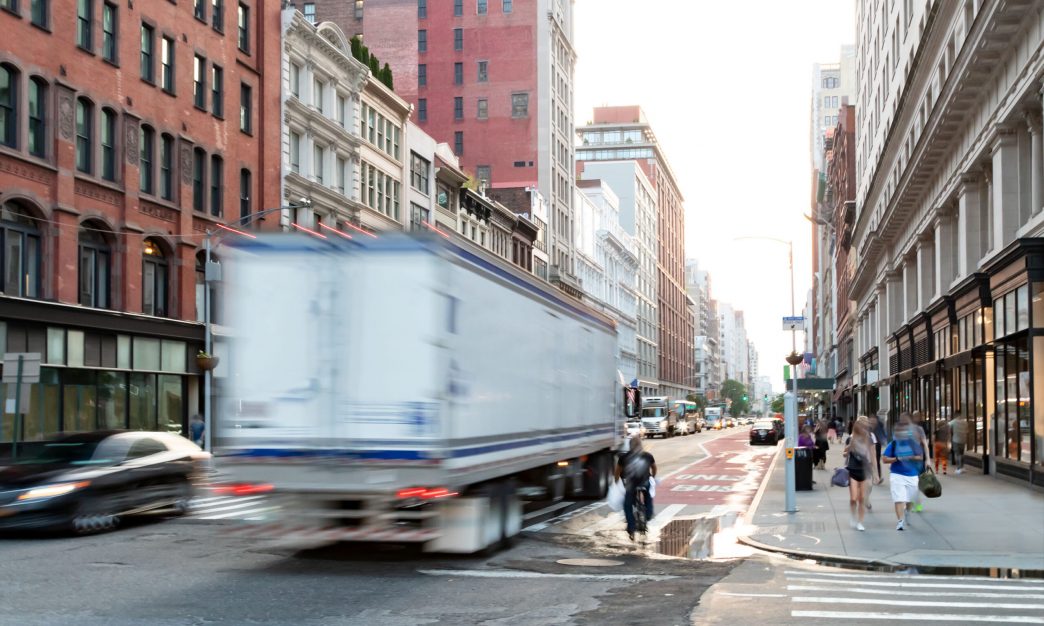 Busy view of 23rd Street with delivery truck in city